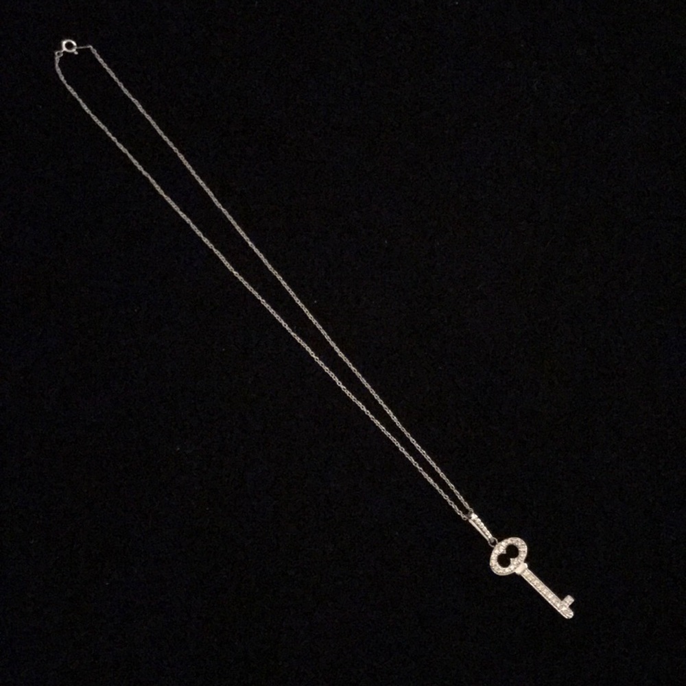 14 K white gold diamond key pendant